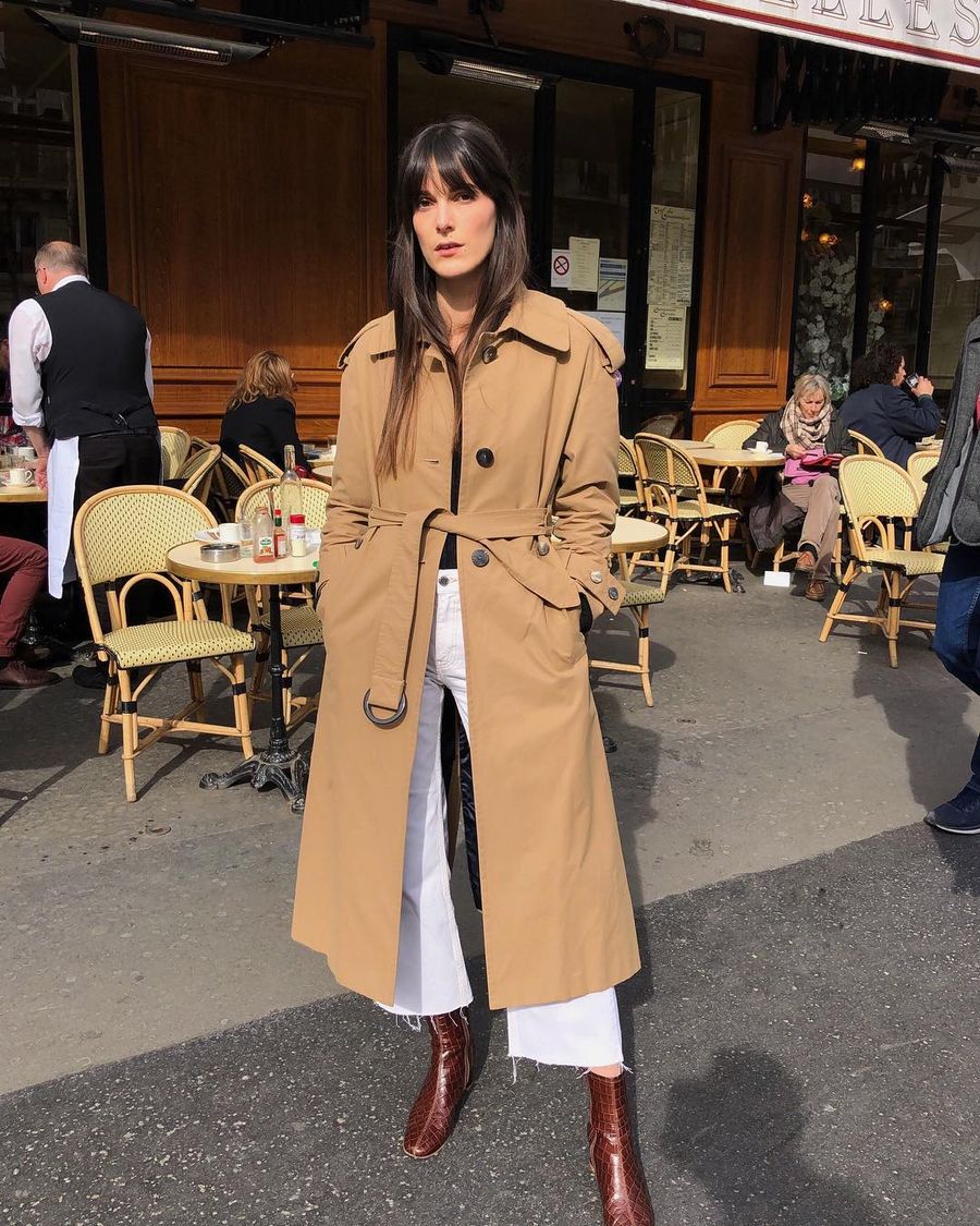 Five-Piece French Wardrobe basics - trench coat, white jeans, leather boots via Leia Sfez