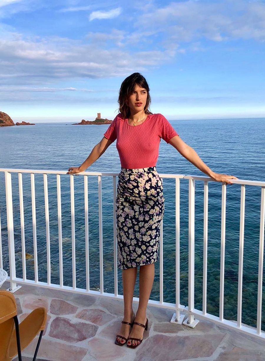 Jeanne Damas Pink sweater and floral skirt and by Far strappy sandals French Girl Spring style inspiration